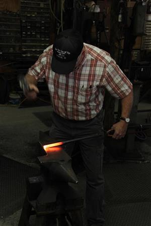 Joe Brown has hammered out thousands of metal leaves at his workshop near his home on Cripple Creek Road. 