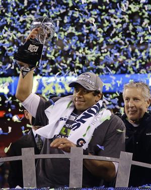 Super Bowl champs Russell Wilson and Pete Carroll. (Above) The Broncos were doomed from Broadway Joe's flubbed coin toss.