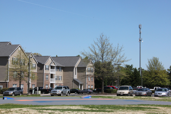 A cell tower hovers over an apartment complex on Lascassas Pike.