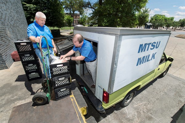 Matthew Wade, left, director of the MTSU Farm Laboratories, and Steve Dixon, new MTSU milk processing manager, delivering milk to campus locations and Hattie Jane's Creamery on the square in downtown Murfreesboro. (MTSU photo by Andy Heidt)