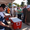 A volunteer pours a sample on the sunny Saturday afternoon