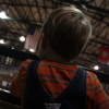 A youngster takes in the action after a ride on the choo choo train